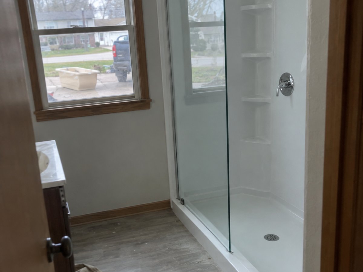 A finished walk-in shower in a Des Moines home, photographed on a phone